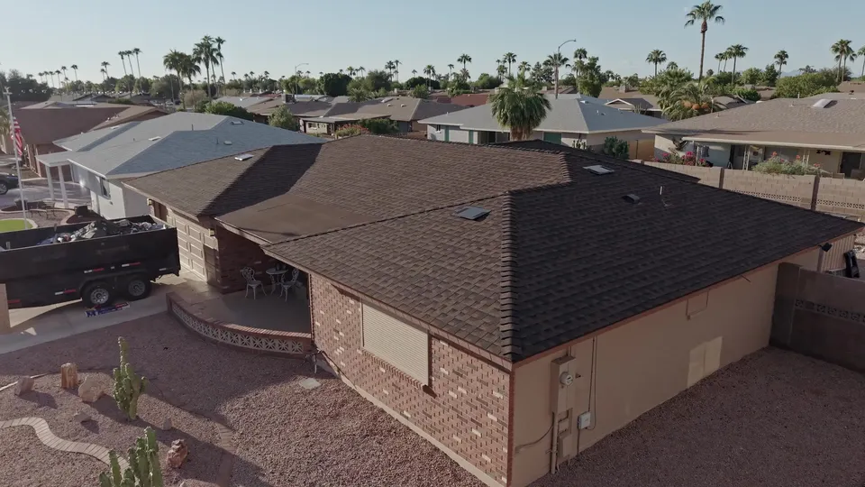 The same home with its finished shingle roof